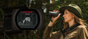 Hunter scanning a field with the Guide Kodiak TK635 thermal monocular
