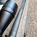 Thermal rifle scope with 10x zoom mounted on camo-patterned rifle for predator hunting