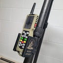 Buff Stuff electronic predator call mounted on carbon fiber pole, featuring keypad controls and antenna for hunting