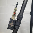 Buff Stuff predator call mounted on carbon fiber rifle stock, ideal for night hunting setups