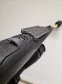 Black thermal rifle scope with textured grip and mounting rail, ideal for predator hunting